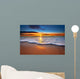 Sunrise light shining on ocean waves. Wall Mural