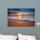 Sunrise light shining on ocean waves. Wall Mural