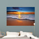 Sunrise light shining on ocean waves. Wall Mural
