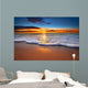 Sunrise light shining on ocean waves. Wall Mural