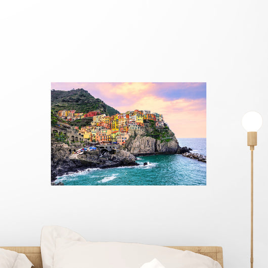 Colorful houses on a rock in Manarola, Cinque Terre, Italy Wall Mural