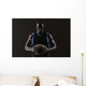 Portrait of basketball player holding a ball Wall Mural