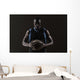 Portrait of basketball player holding a ball Wall Mural
