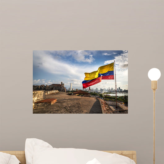 Cartagena, Colombia - August 2nd 2013 - The Colombian flag in the Cartagena Fort in a cloudy and windy day. Cartagena, Colombia Wall Mural