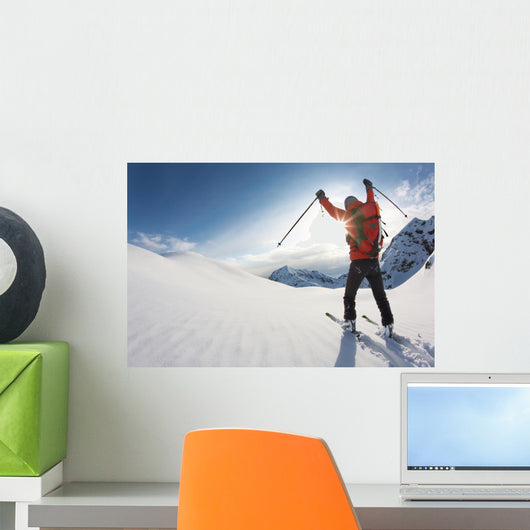 Skier Reaches His Arms up Wall Mural