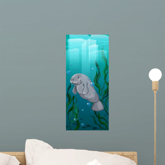 Manatee swimming under the water Wall Mural