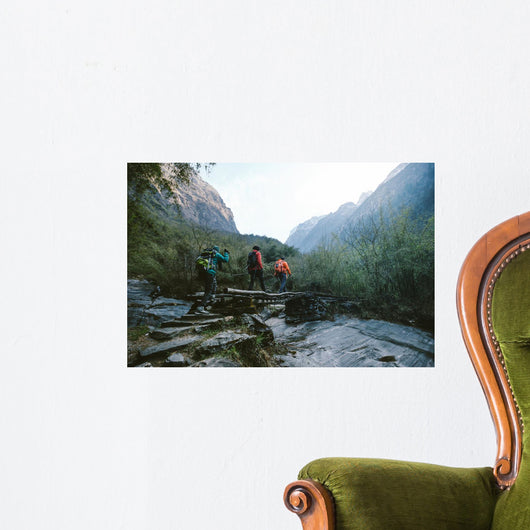 Group of hikers crossing the bridge Wall Mural