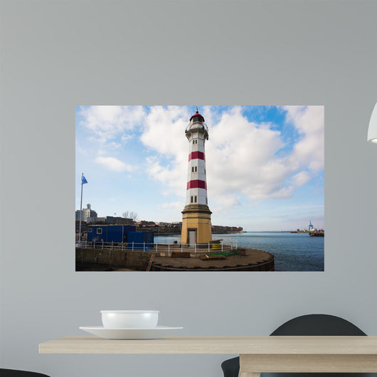 Old striped lighthouse in Oresund, Malmo city harbour Wall Mural
