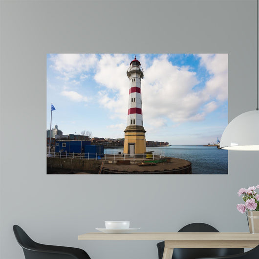 Old striped lighthouse in Oresund, Malmo city harbour Wall Mural