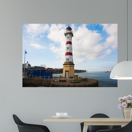 Old striped lighthouse in Oresund, Malmo city harbour Wall Mural