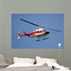 helicopter flying against a deep blue sky Wall Mural