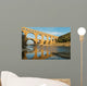 Famous Pont Du Gard reflecting in Gardon river in Southern France Wall Mural