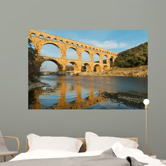 Famous Pont Du Gard reflecting in Gardon river in Southern France Wall Mural
