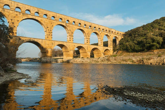 Famous Pont Du Gard reflecting in Gardon river in Southern France Wall Mural