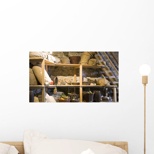nice view on wooden shelf with sacks, baskets in a farm house. Wall Mural
