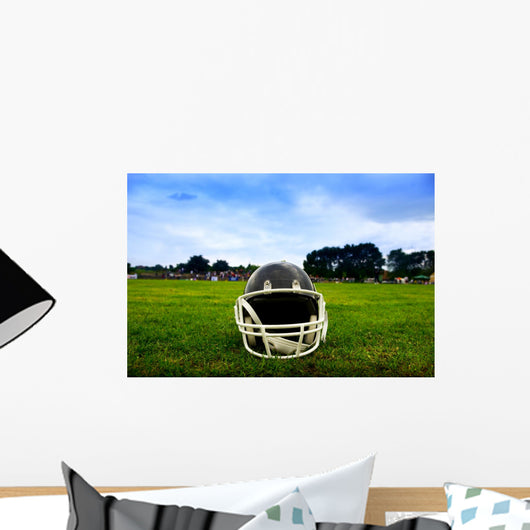 American Football Helmet in Grass Wall Mural