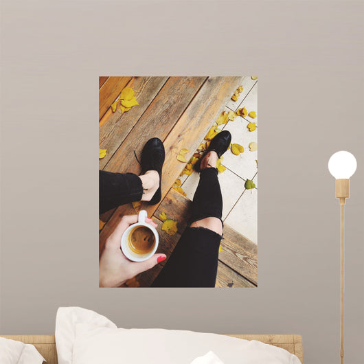 Drinking coffee sit outside cafe, terrace, gold autumn with yellow leafs at the street Wall Mural
