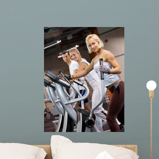 Group of people jogging in a gym Wall Mural