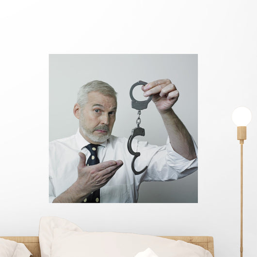 Senior Showing Pair Handcuffs Wall Decal