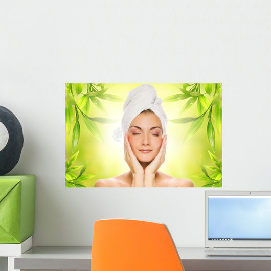 Beautiful young woman applying organic cosmetics to her skin Wall Mural