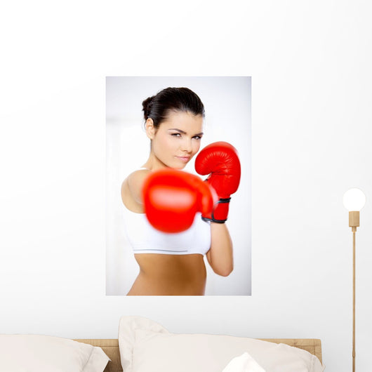 Young beautiful woman during fitness time and boxing Wall Decal
