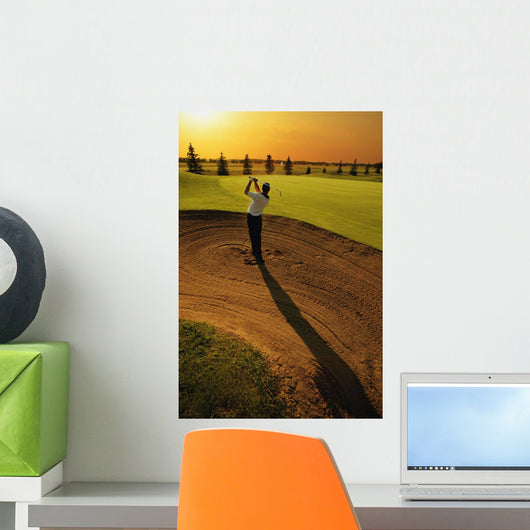 Golfer Taking A Swing From A Golf Bunker Wall Mural