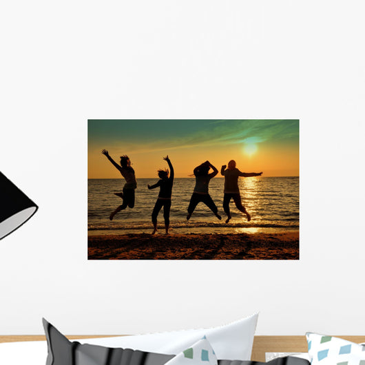 Teens Jumping Beach Wall Mural