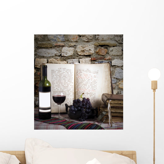 wine bottle and old books Wall Mural