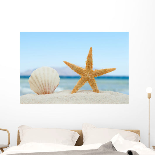 Sea shell and starfish on the beach Wall Mural