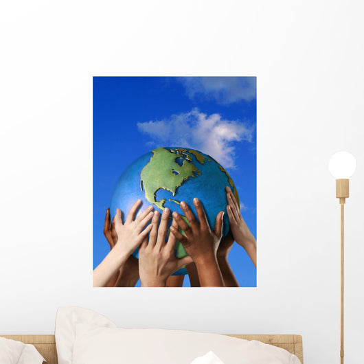 Hands On A Globe Wall Mural