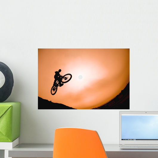 Silhouette Of Stunt Cyclist Wall Mural