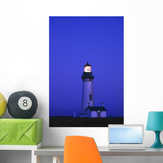 Illuminated Yaquina Head Lighthouse At Dawn Wall Mural
