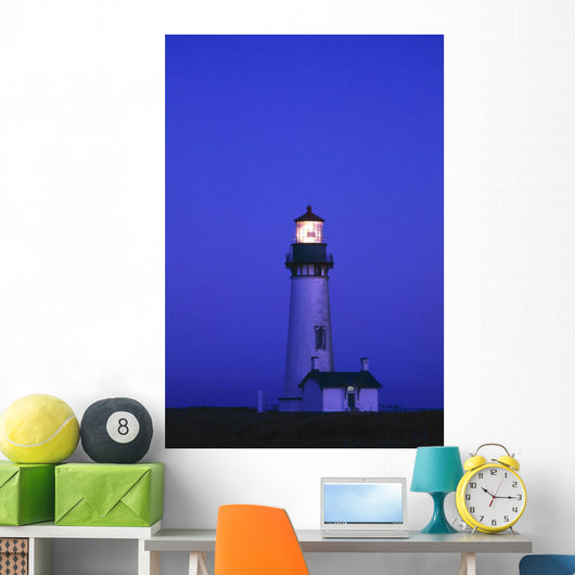 Illuminated Yaquina Head Lighthouse At Dawn Wall Mural