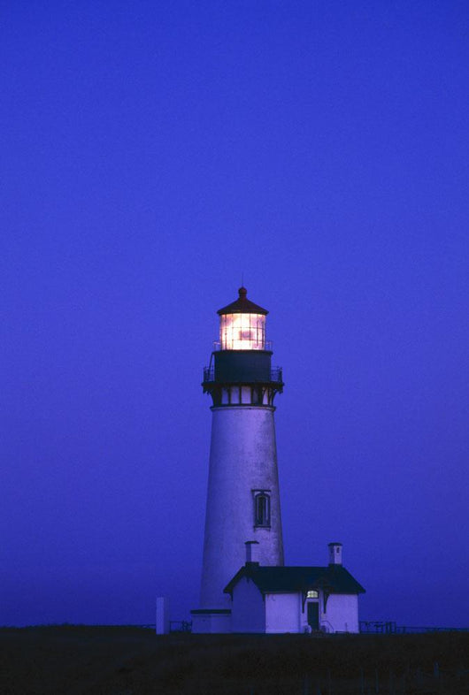Illuminated Yaquina Head Lighthouse At Dawn Wall Mural