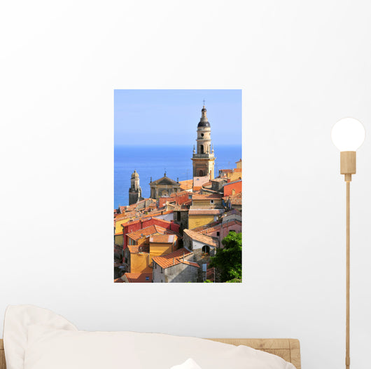 Basilica of St. Michael the Archangel and roofs of Menton in France Wall Mural