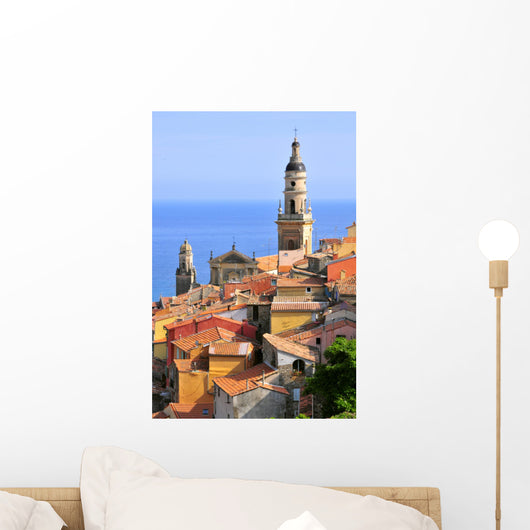 Basilica of St. Michael the Archangel and roofs of Menton in France Wall Mural