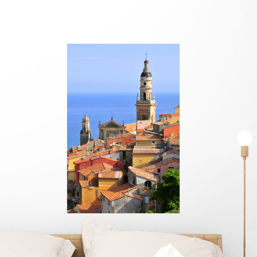 Basilica of St. Michael the Archangel and roofs of Menton in France Wall Mural
