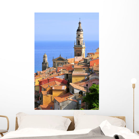 Basilica of St. Michael the Archangel and roofs of Menton in France Wall Mural