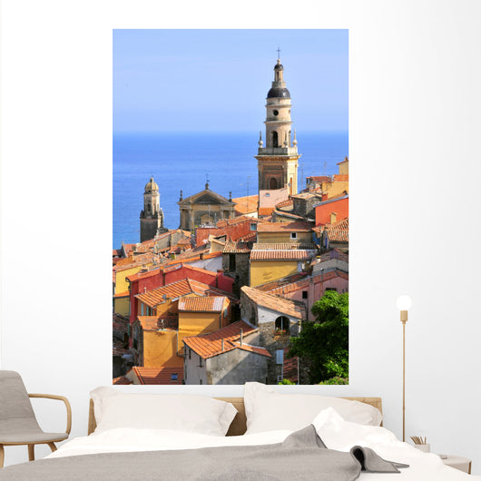 Basilica of St. Michael the Archangel and roofs of Menton in France Wall Mural