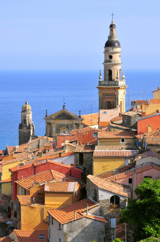 Basilica of St. Michael the Archangel and roofs of Menton in France Wall Mural