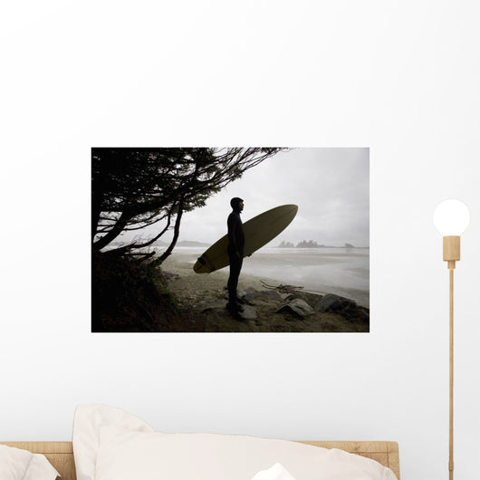 Surfer Observing Water From The Beach Wall Mural