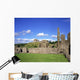 Old Ruins Of An Abbey With A Castle In The Background Wall Mural