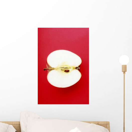 Half An Apple On Red Background Wall Mural
