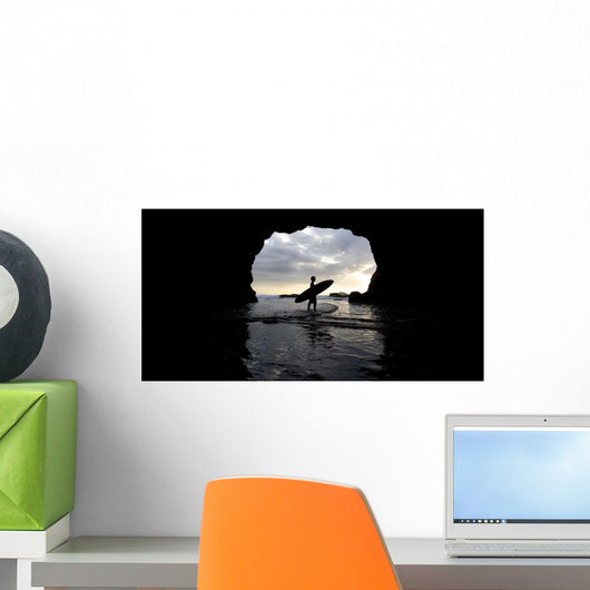 Surfer Inside A Cave At Muriwai New Zealand Wall Mural