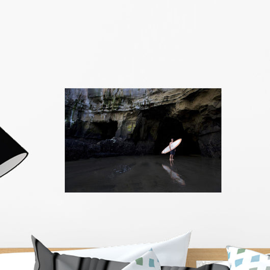 Surfer Inside A Cave At Muriwai, New Zealand Wall Mural