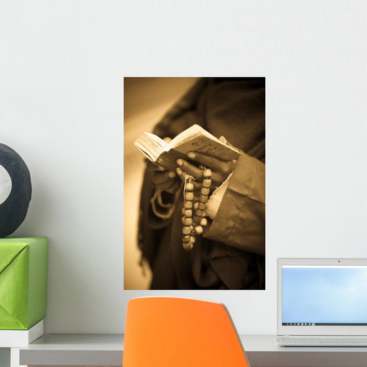 Man Holding Prayer Book Wall Mural
