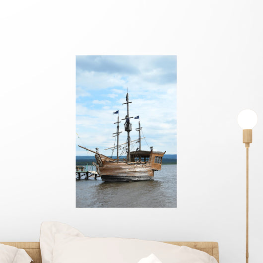 Pirate style ship setting sail on the high seas Wall Mural