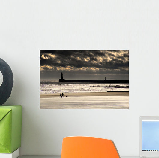 Scenic View Of Sandy Beach With Lighthouse And Groyne Wall Mural