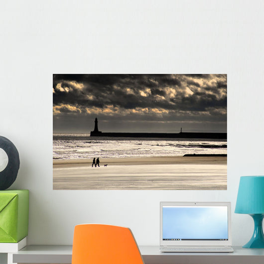 Scenic View Of Sandy Beach With Lighthouse And Groyne Wall Mural
