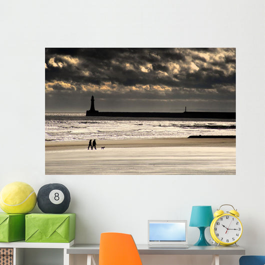 Scenic View Of Sandy Beach With Lighthouse And Groyne Wall Mural